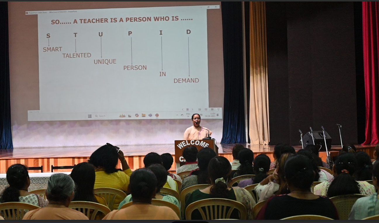Teachers attend a talk by Sister Lizanne